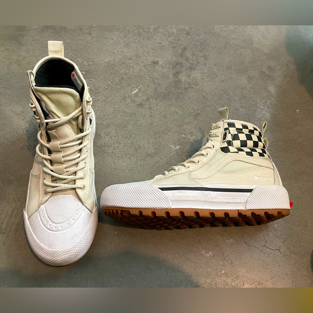 Vans high-top checkered sneakers.